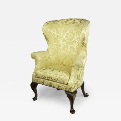An elegant George I walnut wing armchair
