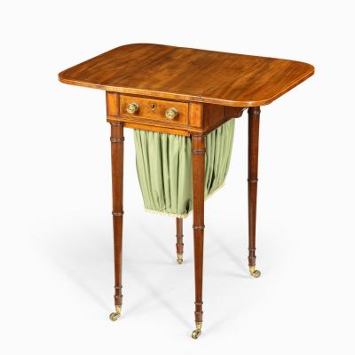 An elegant George III mahogany Pembroke sewing table
