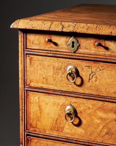 An extremely rare George I walnut chest of small proportions on ball and bracket
