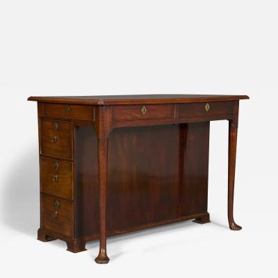 An extremely unusual George II solid mahogany writing table