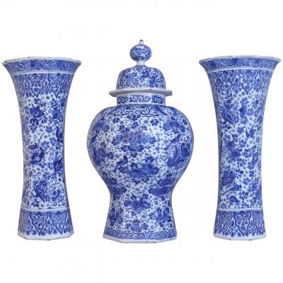 An important and large Dutch Delft garniture set of three vases