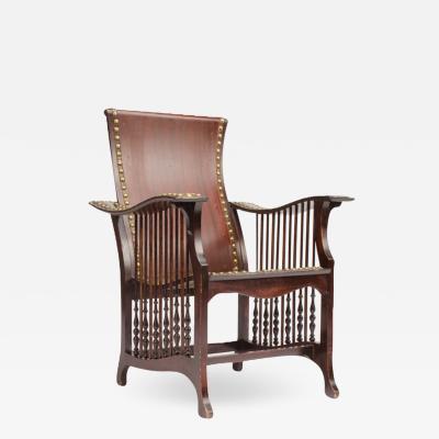 An impressive late 19th Century American mahogany and brass library armchair