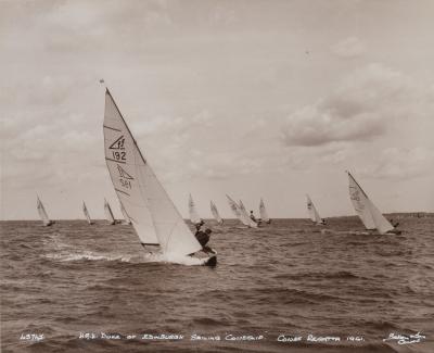 An original Beken photograph of HRH duke of Edinburgh leading the fleet