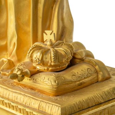 An ormolu mantel clock with Queen Victoria in medieval dress by Monroux 1832