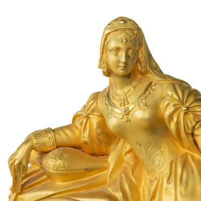 An ormolu mantel clock with Queen Victoria in medieval dress by Monroux 1832