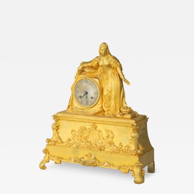 An ormolu mantel clock with Queen Victoria in medieval dress by Monroux 1832