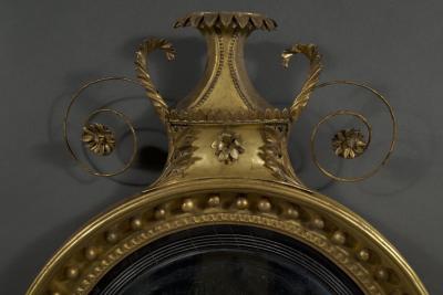 An unusual Regency giltwood convex mirror