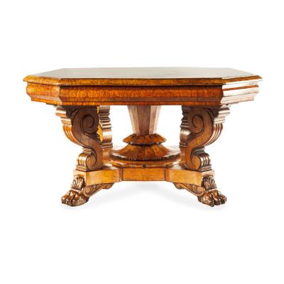 An unusual William IV amboyna and oak four drawer library table by Simpson