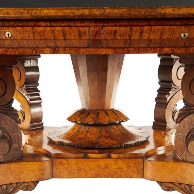 An unusual William IV amboyna and oak four drawer library table by Simpson