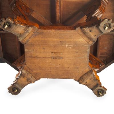 An unusual William IV amboyna and oak four drawer library table by Simpson