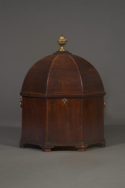 An unusual early george III Mahogany cellarette of octagonal dome