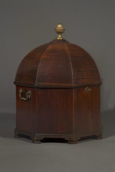 An unusual early george III Mahogany cellarette of octagonal dome