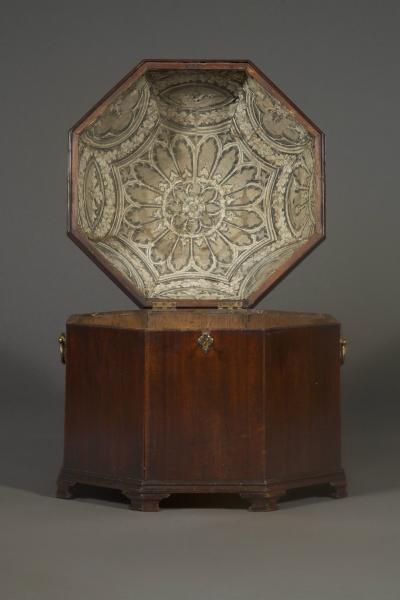 An unusual early george III Mahogany cellarette of octagonal dome