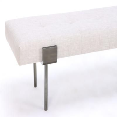 An upholstered iron bench with a bronze patina wrap design Contemporary