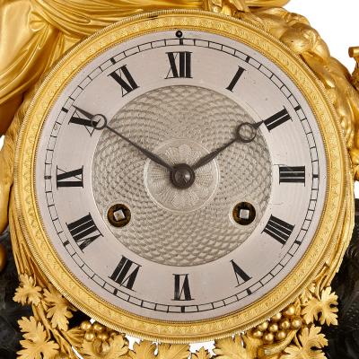 Antique French Empire patinated and gilt bronze mantel clock