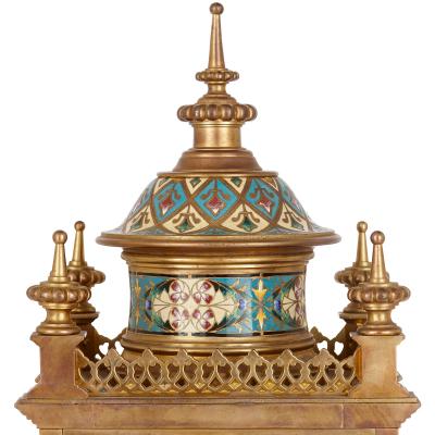 Antique French clock set in champlev enamel and ormolu