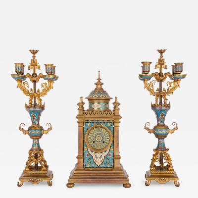 Antique French clock set in champlev enamel and ormolu