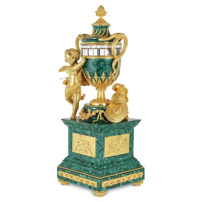 Antique French gilt bronze mounted malachite turning mantel clock