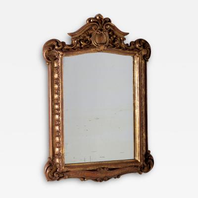 Antique Italian mirror in gilded wood