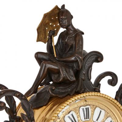 Antique Louis XV style patinated and gilt bronze clock