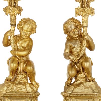 Antique Neoclassical style three piece gilt bronze clock set