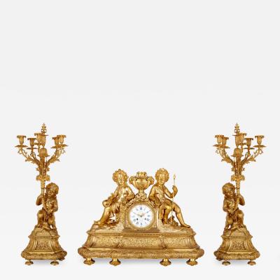 Antique Neoclassical style three piece gilt bronze clock set