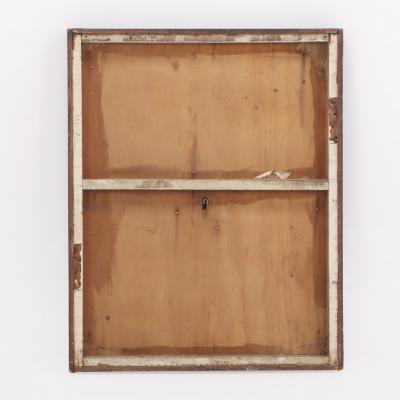 Antique steel lock mechanism mounted on a wooden board 