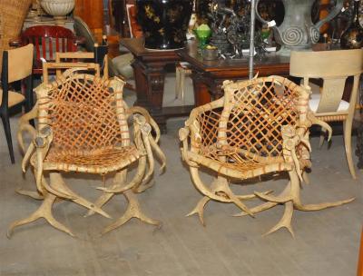 Antler armchairs with leather strappings