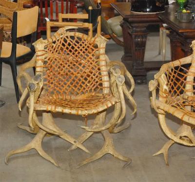 Antler armchairs with leather strappings