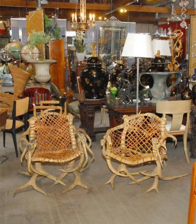 Antler armchairs with leather strappings