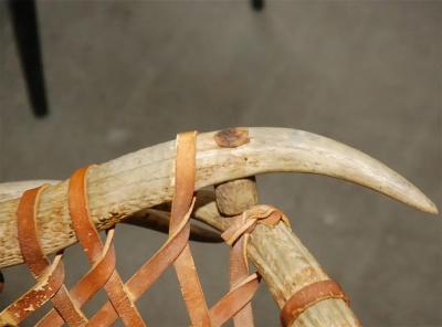 Antler armchairs with leather strappings