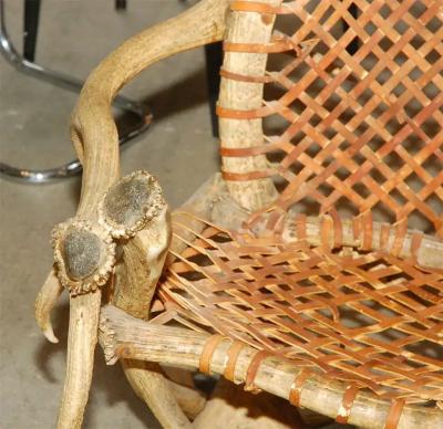 Antler armchairs with leather strappings
