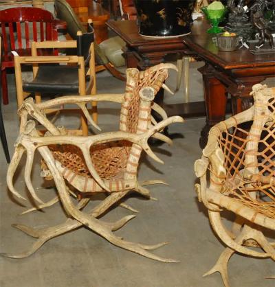 Antler armchairs with leather strappings