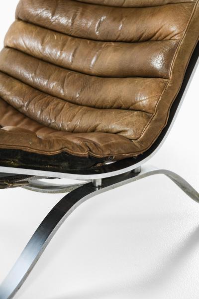 Arne Norell Easy Chair in Leather and Steel with Stool by Arne Norell 1970s