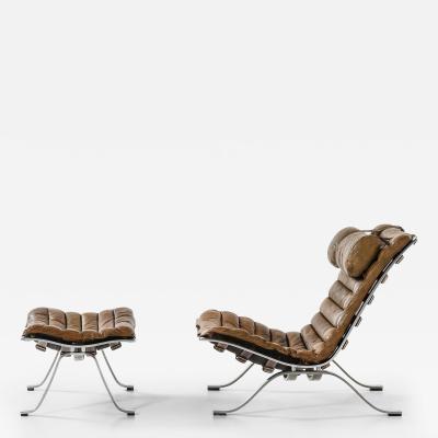 Arne Norell Easy Chair in Leather and Steel with Stool by Arne Norell 1970s