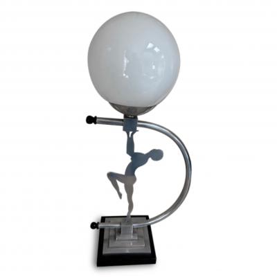 Art Deco Chome lamp with a lady supporting a white glass globe
