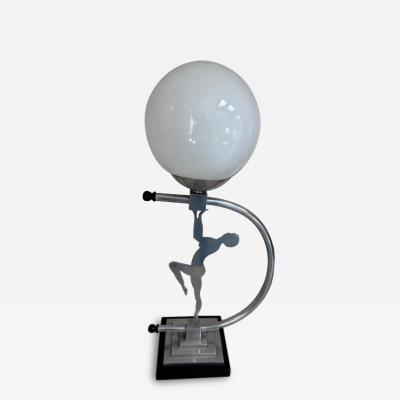Art Deco Chome lamp with a lady supporting a white glass globe