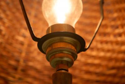 Art Deco Floor Lamp in Patinated Brass with Rattan Shade 1940s