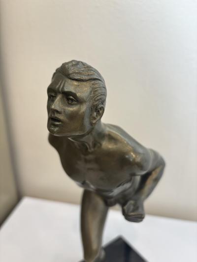 Art Deco bronze figure of a man wearing a loin cloth running