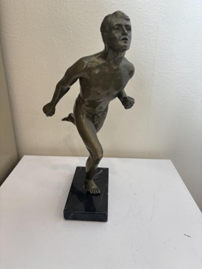 Art Deco bronze figure of a man wearing a loin cloth running