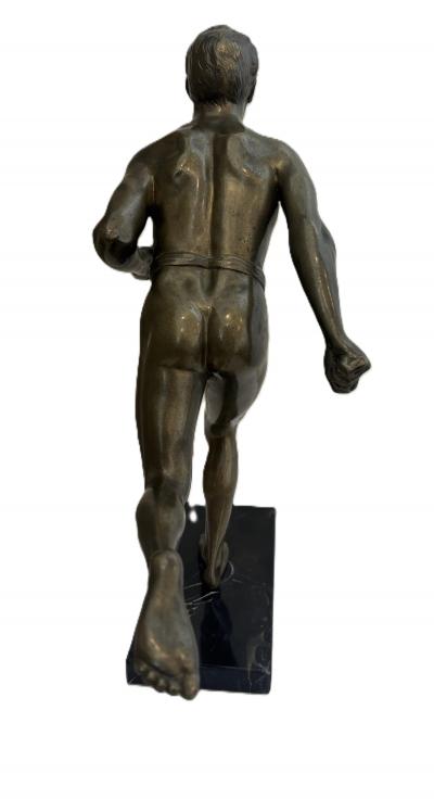 Art Deco bronze figure of a man wearing a loin cloth running
