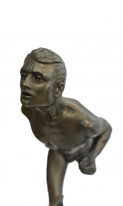 Art Deco bronze figure of a man wearing a loin cloth running