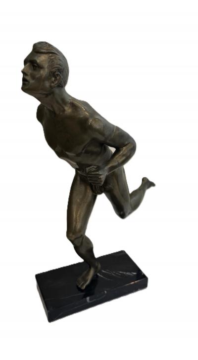 Art Deco bronze figure of a man wearing a loin cloth running