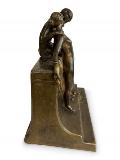 Art Deco bronze group of standing semi nude lady and seated man embracing