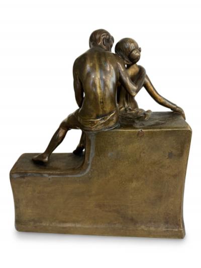 Art Deco bronze group of standing semi nude lady and seated man embracing
