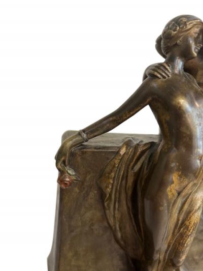 Art Deco bronze group of standing semi nude lady and seated man embracing