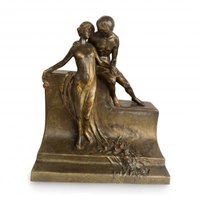 Art Deco bronze group of standing semi nude lady and seated man embracing