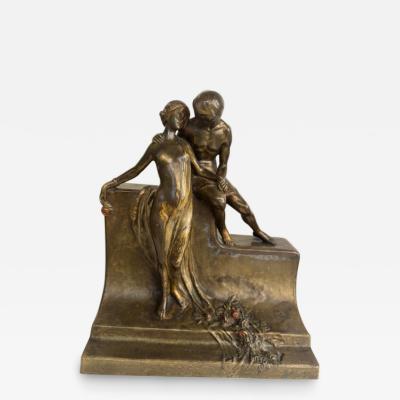 Art Deco bronze group of standing semi nude lady and seated man embracing