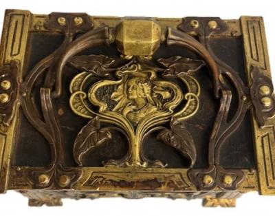 Art Nouveau brass and copper box with head and green velvet interior