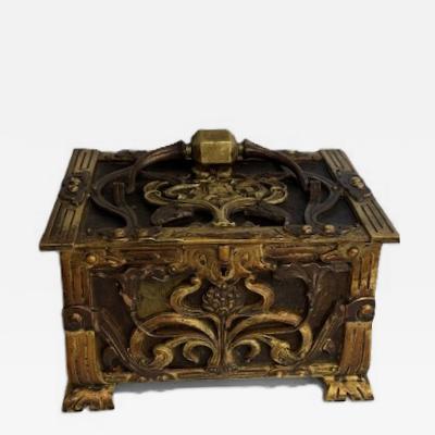 Art Nouveau brass and copper box with head and green velvet interior